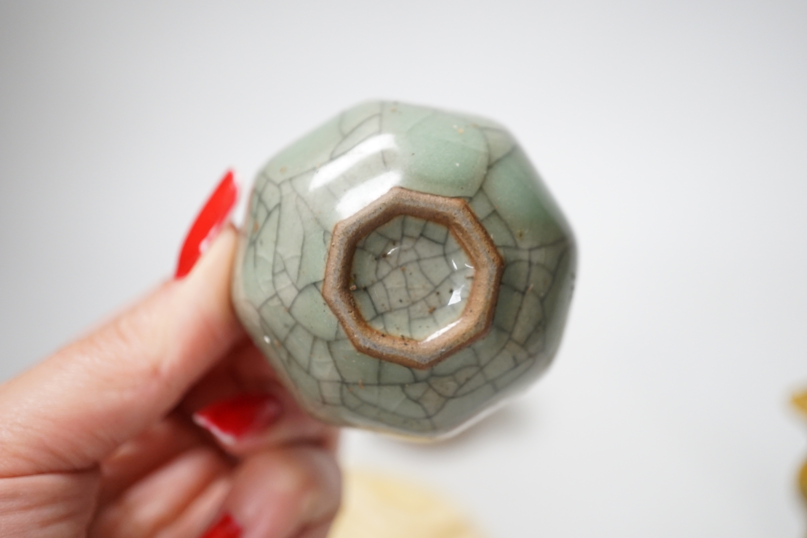 A group of Chinese small ceramics and a hardstone bi disc- 10.5 cm diameter